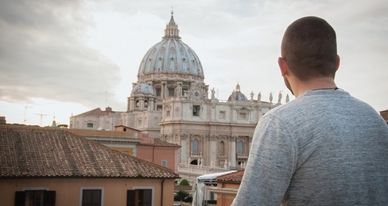 photo of student looking at european architecture.